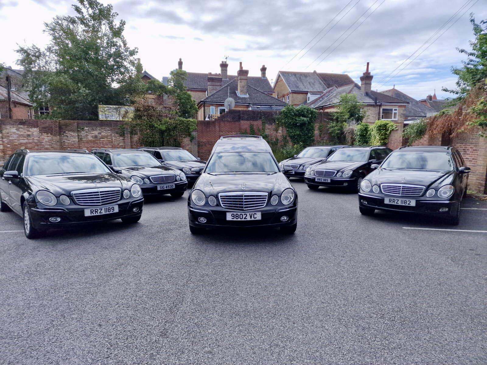 361892520_604880255100994_6904591386300603406_n Black funeral limousines lined up outside building